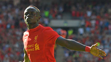 Liverpool's Senegalese midfielder Sadio Mane celebrates after scoring the opening goal of the pre-season International Champions Cup football match between Spanish champions, Barcelona and Liverpool at Wembley stadium in London on August 6, 2016. / AFP / Glyn KIRK (Photo credit should read GLYN KIRK/AFP/Getty Images)