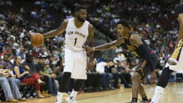 Oct 9, 2015; Jacksonville, FL, USA; Atlanta Hawks guard Kent Bazemore (24) defends New Orleans Pelicans guard Tyreke Evans (1) during the third quarter at Veterans Memorial Arena. The Atlanta Hawks won 103-93. Mandatory Credit: Logan Bowles-USA TODAY Sports