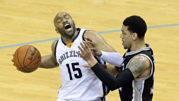 Apr 22, 2016; Memphis, TN, USA; Memphis Grizzlies guard Vince Carter (15) drives against San Antonio Spurs guard Danny Green (14) in game three of the first round of the NBA Playoffs at FedExForum. Mandatory Credit: Nelson Chenault-USA TODAY Sports