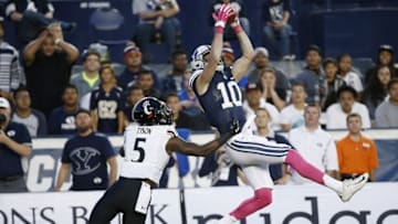Oct 16, 2015; Provo, UT, USA; Brigham Young Cougars wide receiver Mitch Mathews (10) makes a reception against the Cincinnati Bearcats safety Mike Tyson (5) during the second quarter at Lavell Edwards Stadium. Mandatory Credit: Jeff Swinger-USA TODAY Sports