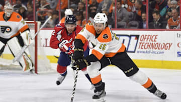Dec 21, 2016; Philadelphia, PA, USA; Philadelphia Flyers defenseman Michael Del Zotto (15) skates with the puck past Washington Capitals center Evgeny Kuznetsov (92) during the first period at Wells Fargo Center. Mandatory Credit: Derik Hamilton-USA TODAY Sports