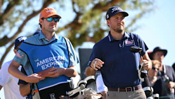 Jan 23, 2022; La Quinta, California, USA; Lee Hodges (right) and caddie Robert Peeler look on from the third tee box during the final round of the American Express golf tournament at Pete Dye Stadium Course. Mandatory Credit: Orlando Ramirez-USA TODAY Sports