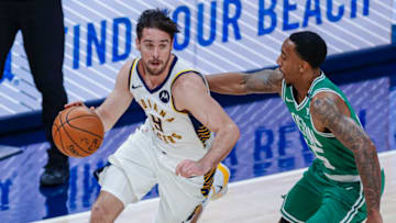 INDIANAPOLIS, IN - DECEMBER 29: T.J. McConnell #9 of the Indiana Pacers dribbles the ball against Jeff Teague #55 of the Boston Celtics at Bankers Life Fieldhouse on December 29, 2020 in Indianapolis, Indiana. NOTE TO USER: User expressly acknowledges and agrees that, by downloading and or using this photograph, User is consenting to the terms and conditions of the Getty Images License Agreement. (Photo by Michael Hickey/Getty Images)