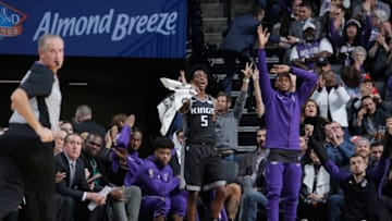 SACRAMENTO, CA - DECEMBER 14: De'Aaron Fox #5 of the Sacramento Kings reacts from the bench during the game against the Golden State Warriors on December 14, 2018 at Golden 1 Center in Sacramento, California. NOTE TO USER: User expressly acknowledges and agrees that, by downloading and or using this Photograph, user is consenting to the terms and conditions of the Getty Images License Agreement. Mandatory Copyright Notice: Copyright 2018 NBAE (Photo by Rocky Widner/NBAE via Getty Images)