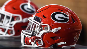 Georgia Bulldogs helmets sit on the sidelines during a game against the Tennessee Volunteers at Neyland Stadium. Mandatory Credit: Bryan Lynn-USA TODAY Sports
