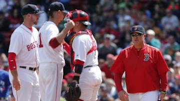 Apr 18, 2016; Boston, MA, USA; Boston Red Sox manager John Farrell (right) comes to take starting pitcher Clay Buchholz (second from left) out of a game against the Toronto Blue Jays during the seventh inning at Fenway Park. Mandatory Credit: Mark L. Baer-USA TODAY Sports