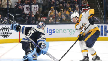 Dec 30, 2021; Columbus, Ohio, USA; Columbus Blue Jackets goalie Elvis Merzlikins (90) stops the the shot of Nashville Predators center Ryan Johansen (92) during the shootout at Nationwide Arena. Mandatory Credit: Russell LaBounty-USA TODAY Sports