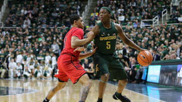 EAST LANSING, MI - JANUARY 4: Cassius Winston #5 of the Michigan State Spartans handles the ball defended by Anthony Cowan Jr. #1 of the Maryland Terrapins at Breslin Center on January 4, 2018 in East Lansing, Michigan. (Photo by Rey Del Rio/Getty Images)