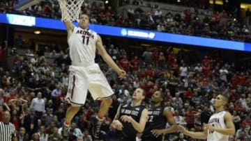 Mar 27, 2014; Anaheim, CA, USA; Arizona Wildcats forward Aaron Gordon (11) dunks the ball past San Diego State Aztecs forward Matt Shrigley (40) during the second half in the semifinals of the west regional of the 2014 NCAA Mens Basketball Championship tournament at Honda Center. Mandatory Credit: Richard Mackson-USA TODAY Sports