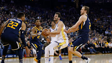 OAKLAND, CA - DECEMBER 27: Omri Casspi #18 of the Golden State Warriors looks to shoot against Thabo Sefolosha #22 and Joe Ingles #2 of the Utah Jazz at ORACLE Arena on December 27, 2017 in Oakland, California. NOTE TO USER: User expressly acknowledges and agrees that, by downloading and or using this photograph, User is consenting to the terms and conditions of the Getty Images License Agreement. (Photo by Lachlan Cunningham/Getty Images)