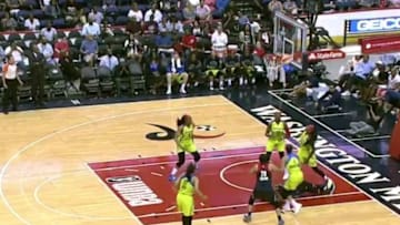 Krystal Thomas shoots from her back, on the ground. (screenshot)