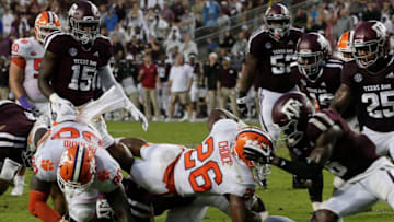COLLEGE STATION, TX - SEPTEMBER 08: Adam Choice #26 of the Clemson Tigers is stopped by Donovan Wilson #6 of the Texas A&M Aggies in the second quarter at Kyle Field on September 8, 2018 in College Station, Texas. (Photo by Bob Levey/Getty Images)