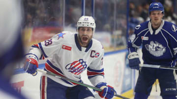 SYRACUSE, NY - APRIL 22: Michael Mersch #28 of Rochester Americans makes a callout against the Syracuse Crunch during the second period during Game 2 of the north division semifinals of the Calder Cup Playoffs at Upstate Medical University Arena on April 22, 2023 in Syracuse, New York. (Photo by Isaiah Vazquez/Getty Images)