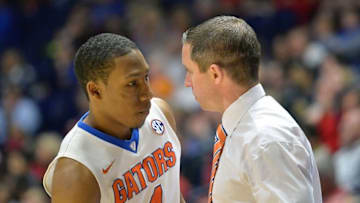 Mar 10, 2016; Nashville, TN, USA; Florida Gators head coach Mike White talks with Gators guard KeVaughn Allen (4) during the second half of the second game of the SEC tournament against the Arkansas Razorbacks at Bridgestone Arena. Mandatory Credit: Jim Brown-USA TODAY Sports