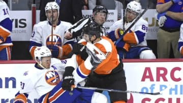 Dec 8, 2015; Philadelphia, PA, USA; Philadelphia Flyers center Brayden Schenn (10) checks New York Islanders right wing Kyle Okposo (21) during the third period at Wells Fargo Center. The Islanders defeated the Flyers, 4-3 in a shootout. Mandatory Credit: Eric Hartline-USA TODAY Sports