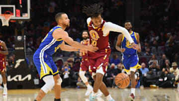CLEVELAND, OHIO - NOVEMBER 18: Stephen Curry #30 of the Golden State Warriors fouls Darius Garland #10 of the Cleveland Cavaliers during the second half at Rocket Mortgage Fieldhouse on November 18, 2021 in Cleveland, Ohio. The Warriors defeated the Cavaliers 104-89. NOTE TO USER: User expressly acknowledges and agrees that, by downloading and/or using this photograph, user is consenting to the terms and conditions of the Getty Images License Agreement. (Photo by Jason Miller/Getty Images)