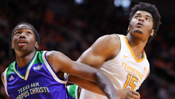 KNOXVILLE, TN - DECEMBER 2: Irshaad Hunte #15 of the Texas A&M-CC Islanders fights for position with Derrick Walker #15 of the Tennessee Volunteers during the second half of their game at Thompson-Boling Arena on December 2, 2018 in Knoxville, Tennessee. Tennessee won the game 79-51. (Photo by Donald Page/Getty Images)