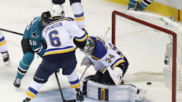 SAN JOSE, CA - MAY 21: Joel Edmundson #6 of the St. Louis Blues hits the puck in between the legs of Jake Allen #34 for a San Jose Sharks goal in game four of the Western Conference Finals against the San Jose Sharks during the 2016 NHL Stanley Cup Playoffs at SAP Center on May 21, 2016 in San Jose, California. (Photo by Sean M. Haffey/Getty Images)
