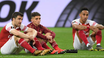 BAKU, AZERBAIJAN - MAY 29: Sokratis Papastathopoulos, Lucas Torreira, and Pierre-Emerick Aubameyang of Arsenal look dejected following their sides defeat in the UEFA Europa League Final between Chelsea and Arsenal at Baku Olimpiya Stadionu on May 29, 2019 in Baku, Azerbaijan. (Photo by Michael Regan/Getty Images)