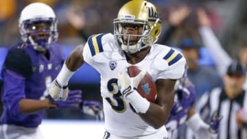 Nov 8, 2014; Seattle, WA, USA; UCLA Bruins running back Myles Jack (30) rushes for a 28-yard touchdown against the Washington Huskies during the second quarter at Husky Stadium. Mandatory Credit: Joe Nicholson-USA TODAY Sports