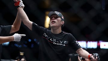 SINGAPORE - OCTOBER 18: Shinya Aoki of Japan celebrates victory over Cody Stevens of United States of America during the One Fighting Championship Featherweight bout at Singapore Indoor Stadium on October 18, 2013 in Singapore. (Photo by Suhaimi Abdullah/Getty Images)