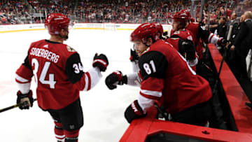 GLENDALE, ARIZONA - NOVEMBER 07: Phil Kessel #81 of the Arizona Coyotes congratulates teammate Carl Soderberg #34 after Soderberg's goal against the Columbus Blue Jackets during the first period at Gila River Arena on November 07, 2019 in Glendale, Arizona. (Photo by Norm Hall/NHLI via Getty Images)