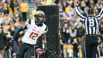 Oct 31, 2015; Iowa City, IA, USA; Maryland Terrapins wide receiver Taivon Jacobs (12) celebrates a touchdown after a 7 yard pass catch during the second half against the Iowa Hawkeyes at Kinnick Stadium. Iowa won 31-15. Mandatory Credit: Jeffrey Becker-USA TODAY Sports