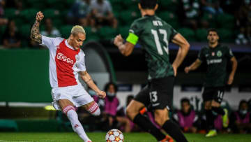 Ajax's Brazilian forward Anthony (L) kicks the ball during the UEFA Champions League first round group C football match between Sporting CP and Ajax at the Jose Alvalade stadium in Lisbon on September 15, 2021. (Photo by PATRICIA DE MELO MOREIRA / AFP) (Photo by PATRICIA DE MELO MOREIRA/AFP via Getty Images)