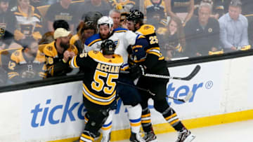 BOSTON, MASSACHUSETTS - JUNE 12: Pat Maroon #7 of the St. Louis Blues is checked into the boards by Noel Acciari #55 and Brandon Carlo #25 of the Boston Bruins in Game Seven of the 2019 NHL Stanley Cup Final at TD Garden on June 12, 2019 in Boston, Massachusetts. (Photo by Rich Gagnon/Getty Images)
