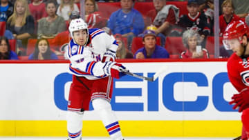 Oct 28, 2016; Raleigh, NC, USA; New York Rangers forward Mika Zibanejad (93) gets off a shot during the game against the Carolina Hurricanes at PNC Arena. The Carolina Hurricanes defeated the New York Rangers 3-2. Mandatory Credit: James Guillory-USA TODAY Sports