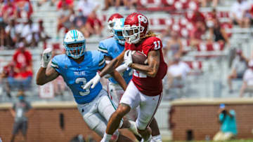 Sep 4, 2021; Norman, Oklahoma, USA; Oklahoma Sooners wide receiver Jadon Haselwood (11) runs with the ball as Tulane Green Wave defensive lineman Angelo Anderson (3) chases during the fourth quarter at Gaylord Family-Oklahoma Memorial Stadium. Mandatory Credit: Kevin Jairaj-USA TODAY Sports