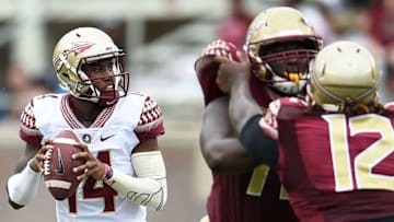TALLAHASSEE, FL - APRIL 11: De'Andre Johnson #14 of the Gold team drops back to pass against the Garnet team during Florida State's Garnet and Gold spring game at Doak Campbell Stadium on April 11, 2015 in Tallahassee, Florida. (Photo by Stacy Revere/Getty Images)