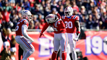 FOXBOROUGH, MASSACHUSETTS - OCTOBER 09: Matthew Judon #9 of the New England Patriots celebrates with Josh Uche #55 of the New England Patriots and Mack Wilson Sr. #30 of the New England Patriots after a sack during the second quarter against the Detroit Lions at Gillette Stadium on October 09, 2022 in Foxborough, Massachusetts. (Photo by Maddie Malhotra/Getty Images)