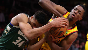 ATLANTA, GEORGIA - JANUARY 17: Onyeka Okongwu #17 of the Atlanta Hawks earns a jump ball as he defends against Giannis Antetokounmpo #34 of the Milwaukee Bucks during the second half at State Farm Arena on January 17, 2022 in Atlanta, Georgia. NOTE TO USER: User expressly acknowledges and agrees that, by downloading and or using this photograph, User is consenting to the terms and conditions of the Getty Images License Agreement. (Photo by Kevin C. Cox/Getty Images)