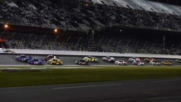 Feb 20, 2015; Daytona Beach, FL, USA; Camping World Truck Series drivers Tyler Reddick (19) and Austin Theriault (29) lead the pack during the Nextera Energy Resources 250 at Daytona International Speedway. Mandatory Credit: Jasen Vinlove-USA TODAY Sports