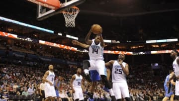 Dec 27, 2014; Charlotte, NC, USA; Charlotte Hornets forward Michael Kidd-Gilchrist (14) gets a rebound during the second half of the game against the Orlando Magic at Time Warner Cable Arena. Orlando wins 102-94. Mandatory Credit: Sam Sharpe-USA TODAY Sports