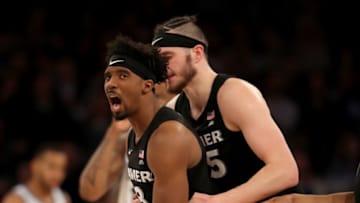 NEW YORK, NEW YORK - MARCH 15: Quentin Goodin #3 is consoled by teammate Zach Hankins #35 of the Xavier Musketeers after Goodin overthrew a pass to Hankins and the ball went out of bounds in the overtime period against the Villanova Wildcats during the semifinal round of the Big East Tournament at Madison Square Garden on March 15, 2019 in New York City. (Photo by Elsa/Getty Images)