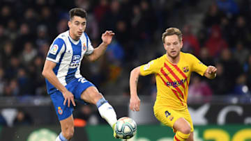 BARCELONA, SPAIN - JANUARY 04: Marc Roca of Espanyol is put under pressure by Ivan Rakitic of FC Barcelona during the La Liga match between RCD Espanyol and FC Barcelona at RCDE Stadium on January 04, 2020 in Barcelona, Spain. (Photo by Alex Caparros/Getty Images)