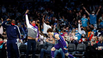 CHARLOTTE, NORTH CAROLINA - NOVEMBER 19: LaMelo Ball #2 of the Charlotte Hornets reacts with the crowd following a three point basket during the second half of their game against the Indiana Pacers at Spectrum Center on November 19, 2021 in Charlotte, North Carolina. NOTE TO USER: User expressly acknowledges and agrees that, by downloading and or using this photograph, User is consenting to the terms and conditions of the Getty Images License Agreement. (Photo by Jared C. Tilton/Getty Images)