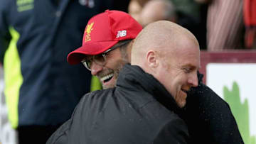 BURNLEY, ENGLAND - JANUARY 01: Sean Dyche, Manager of Burnley and Jurgen Klopp, Manager of Liverpool embrace prior to the Premier League match between Burnley and Liverpool at Turf Moor on January 1, 2018 in Burnley, England. (Photo by Nigel Roddis/Getty Images)
