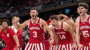 The Indiana bench celebrates late in game action, Thursday, March 10, 2022, during Big Ten tournament men’s play from Indianapolis’ Gainbridge Fieldhouse. Indiana won 74-69.