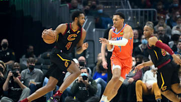 Evan Mobley #4 of the Cavaliers drives to the basket around Darius Bazley #7 of the OKC Thunder . (Photo by Jason Miller/Getty Images)