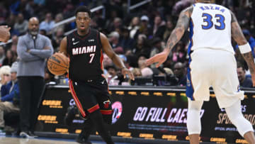 Miami Heat guard Kyle Lowry (7) advances the ball as Washington Wizards forward Kyle Kuzma (33) looks on(Brad Mills-USA TODAY Sports)