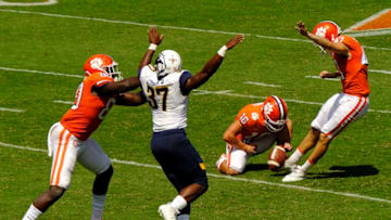 CLEMSON, SC - SEPTEMBER 2: Wide receiver Will Swinney holds the ball for kicker Greg Huegel