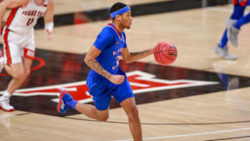 LUBBOCK, TEXAS - DECEMBER 17: Guard Dajuan Harris Jr. #3 of the Kansas Jayhawks handles the ball during the first half of the college basketball game against the Texas Tech Red Raiders at United Supermarkets Arena on December 17, 2020 in Lubbock, Texas. (Photo by John E. Moore III/Getty Images)