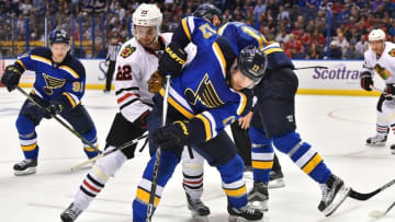 Apr 25, 2016; St. Louis, MO, USA; St. Louis Blues left wing Jaden Schwartz (17) and Chicago Blackhawks center Marcus Kruger (22) battle for the puck during the second period in game seven of the first round of the 2016 Stanley Cup Playoffs at Scottrade Center. Mandatory Credit: Jasen Vinlove-USA TODAY Sports