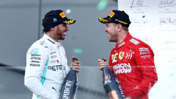 BAKU, AZERBAIJAN - APRIL 28: Second placed Lewis Hamilton of Great Britain and Mercedes GP and third placed Sebastian Vettel of Germany and Ferrari celebrate on the podium during the F1 Grand Prix of Azerbaijan at Baku City Circuit on April 28, 2019 in Baku, Azerbaijan. (Photo by Mark Thompson/Getty Images)