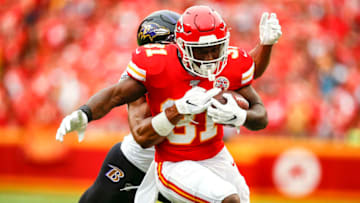 KANSAS CITY, MO - SEPTEMBER 22: Darrel Williams #31 of the Kansas City Chiefs runs after a catch while being tackled by Kenny Young #40 of the Baltimore Ravens at Arrowhead Stadium on September 22, 2019 in Kansas City, Missouri. (Photo by David Eulitt/Getty Images)