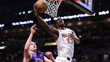 Jimmy Butler #22 of the Miami Heat shoots over Nikola Jokic #15 of the Denver Nuggets(Photo by Megan Briggs/Getty Images)