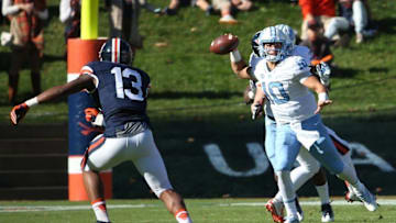 Oct 22, 2016; Charlottesville, VA, USA; North Carolina Tar Heels quarterback Mitch Trubisky (10) throws the ball as Virginia Cavaliers linebacker Chris Peace (13) chases in the first quarter at Scott Stadium. Mandatory Credit: Amber Searls-USA TODAY Sports